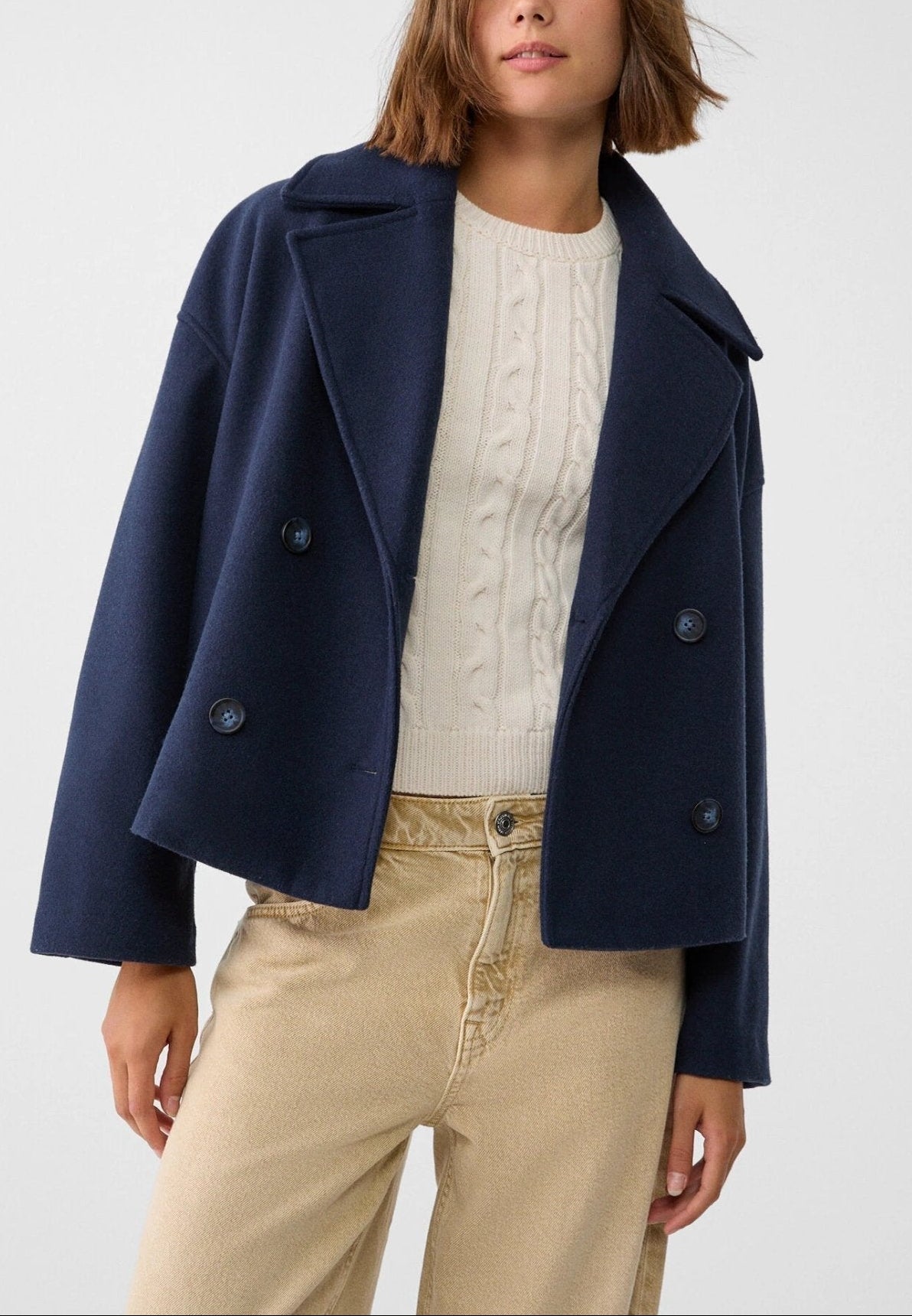 Women tailored short jacket clean lines modern structured silhouette