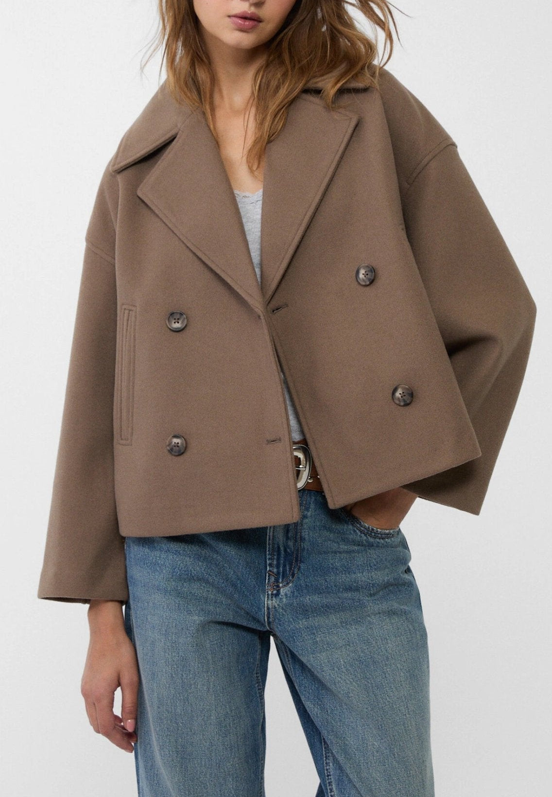 Women tailored short jacket clean lines modern structured silhouette