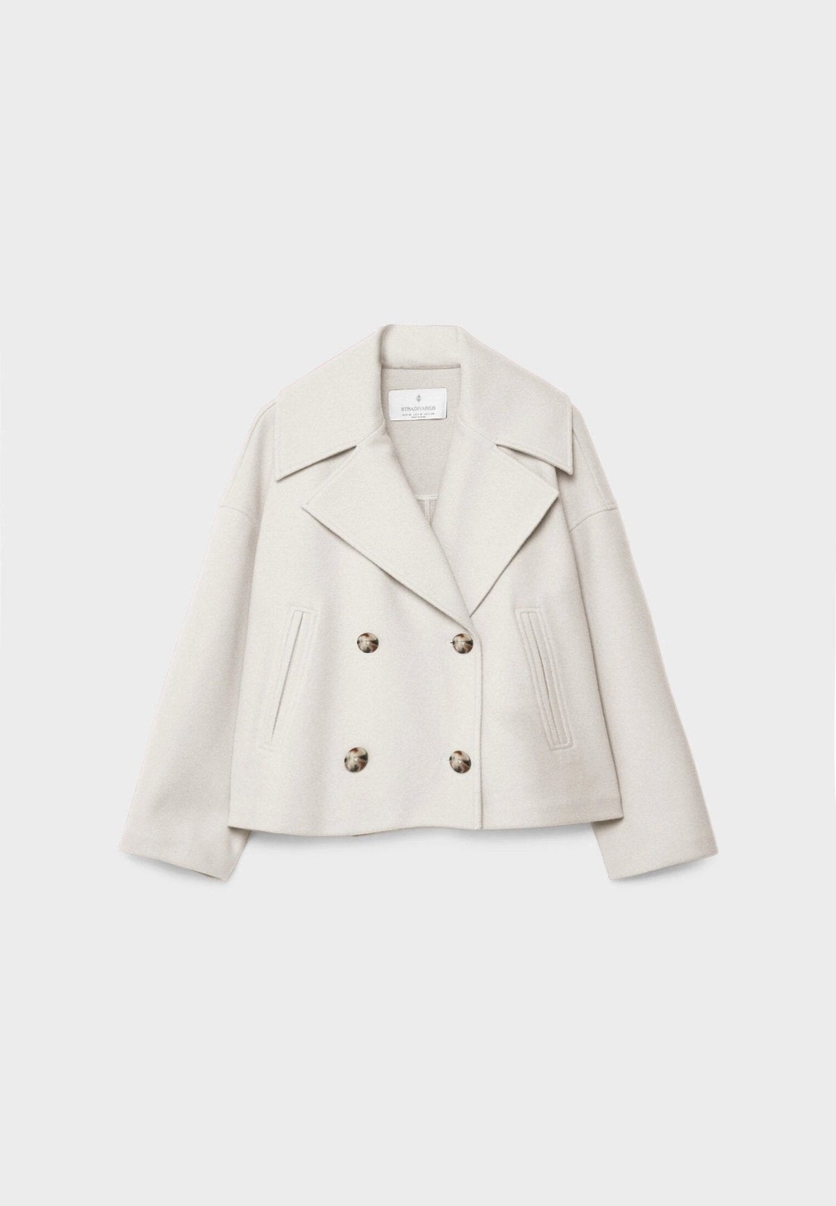 Women tailored short jacket clean lines modern structured silhouette